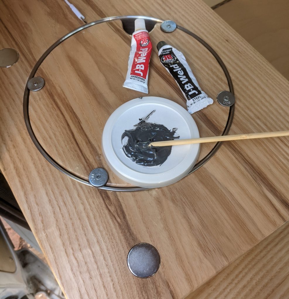 Glue the rare earth magnet in place with Epoxy glue
